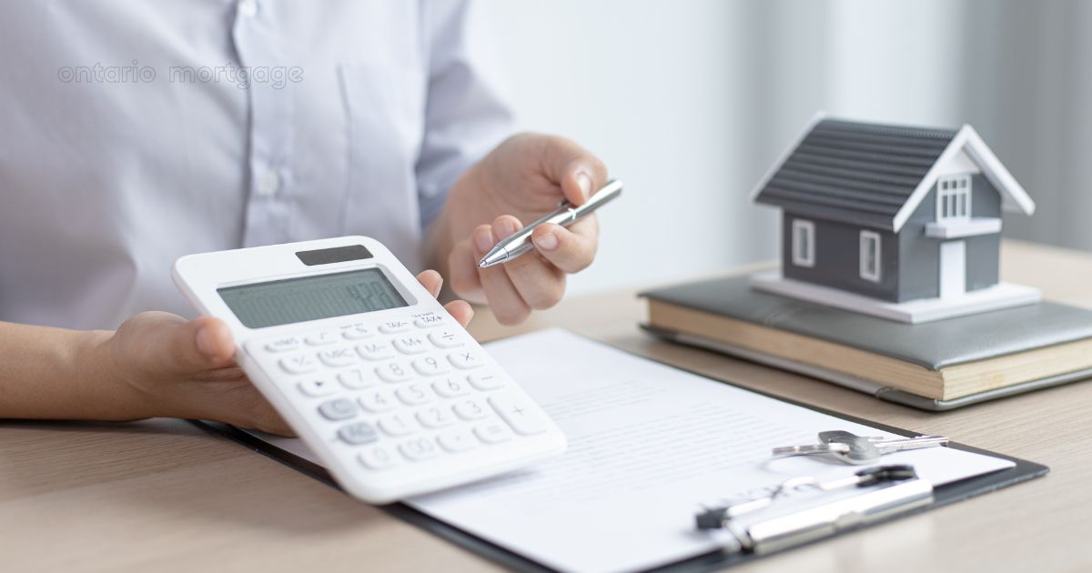 Best mortgage options in Ontario – calculator and loan documents on a table.